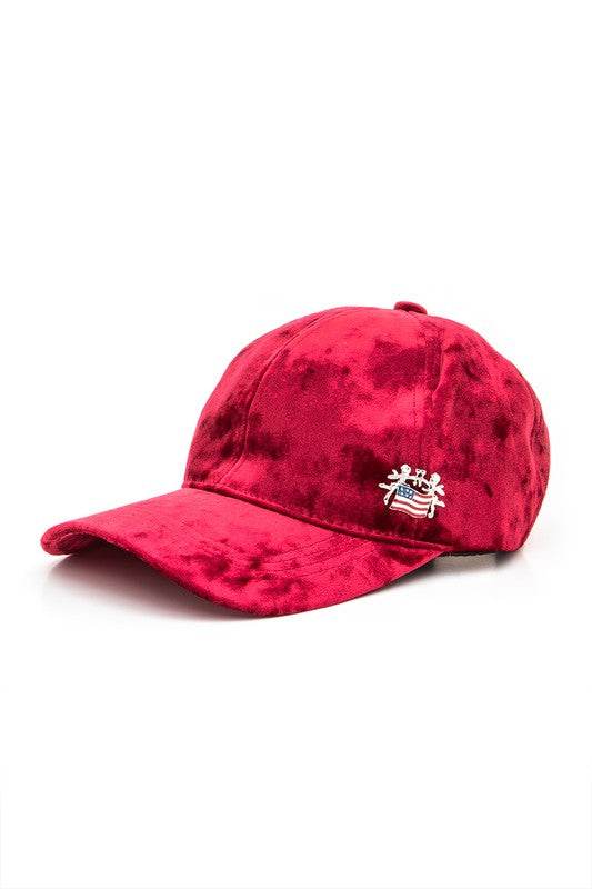 Red tie-dye cap with a small logo on a white background